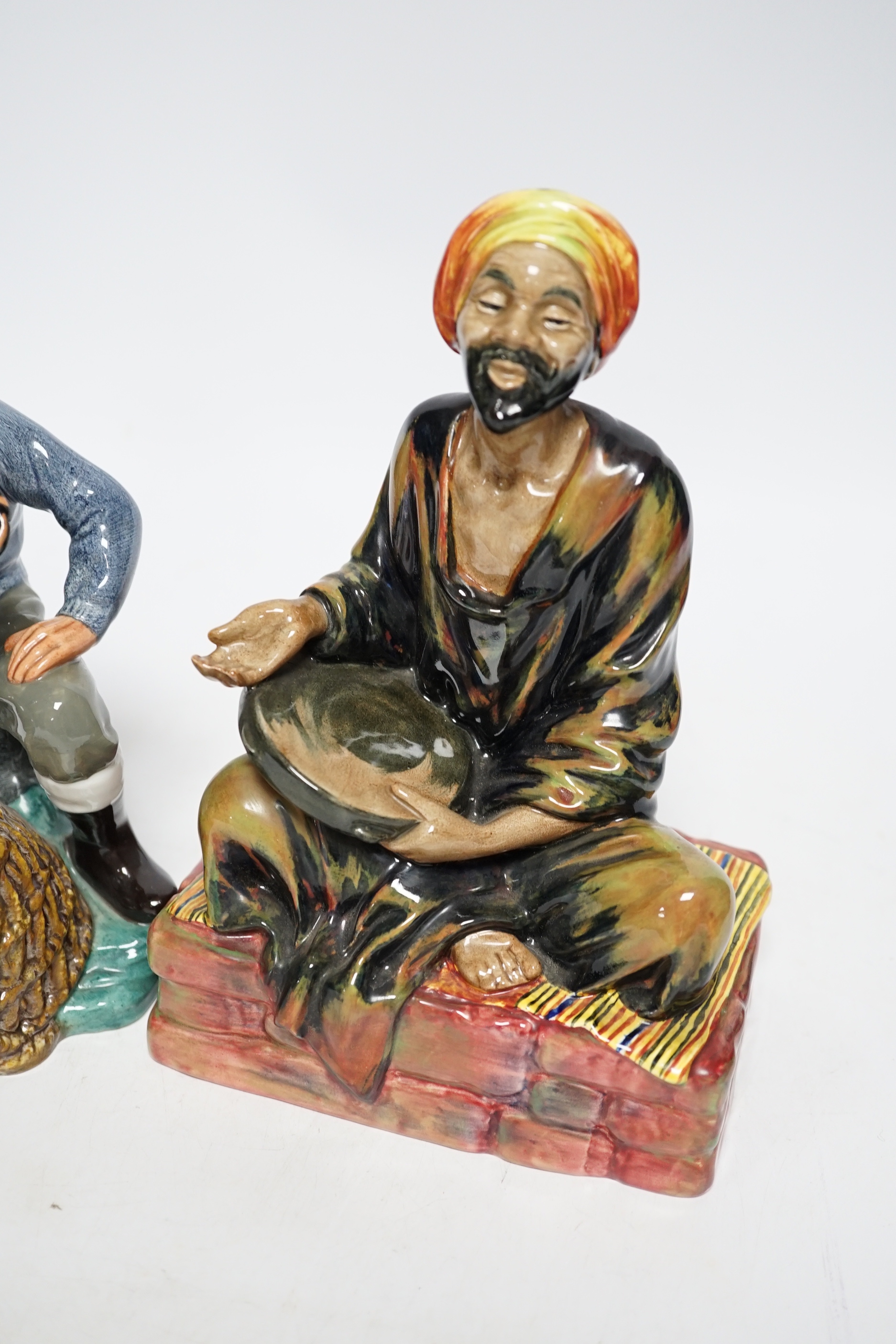 Two Doulton figures, Lobster Man and Mendicant